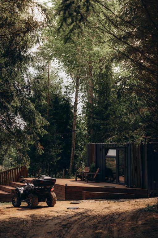 Sidrabgrava private hot tub positioned in a forest clearing