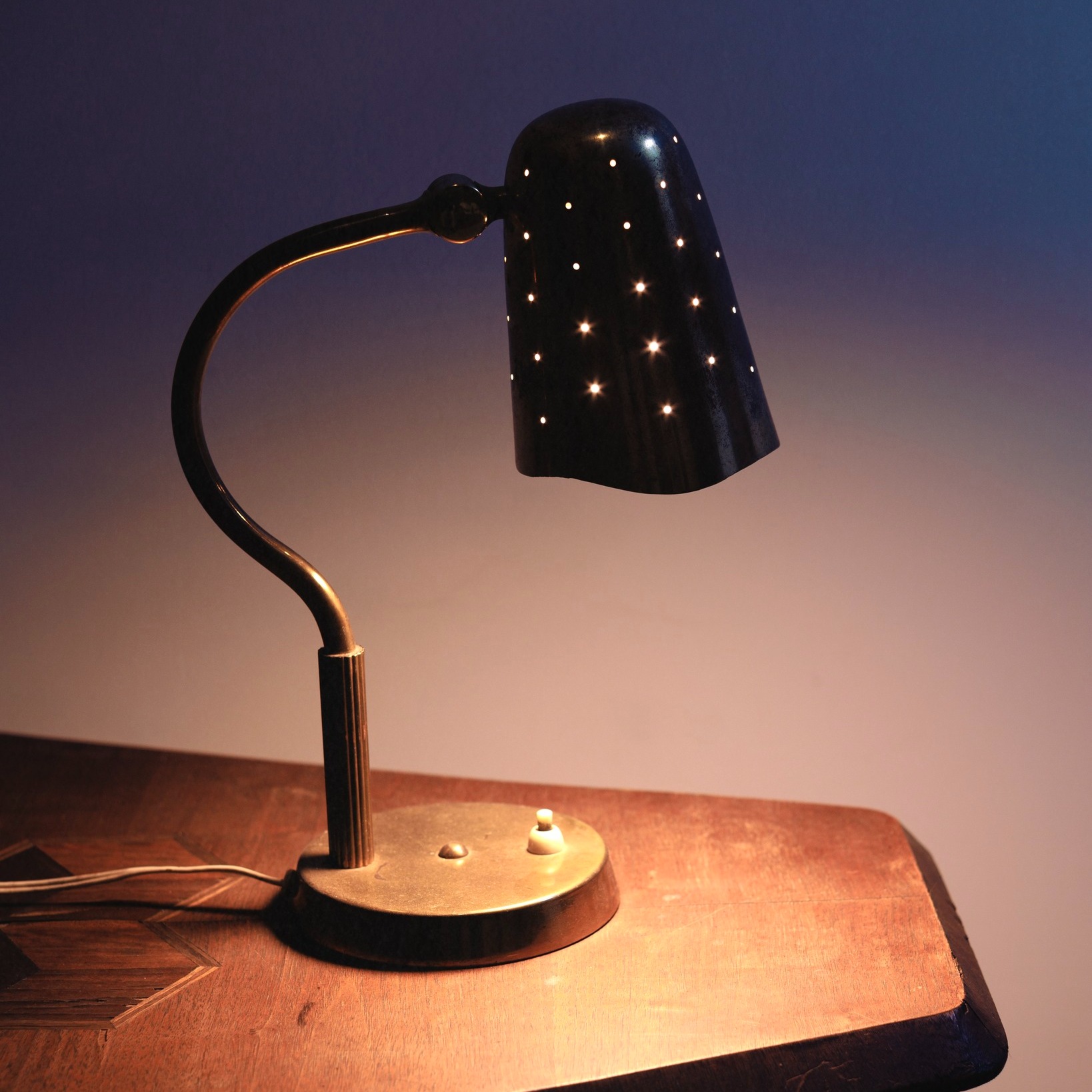 Boréns table lamp doing its magic — that perforated shade turns light into a tiny galaxy ✨ A 1940s Swedish Modern piece — model 8508 by Boréns, crafted in brass with a delicately p