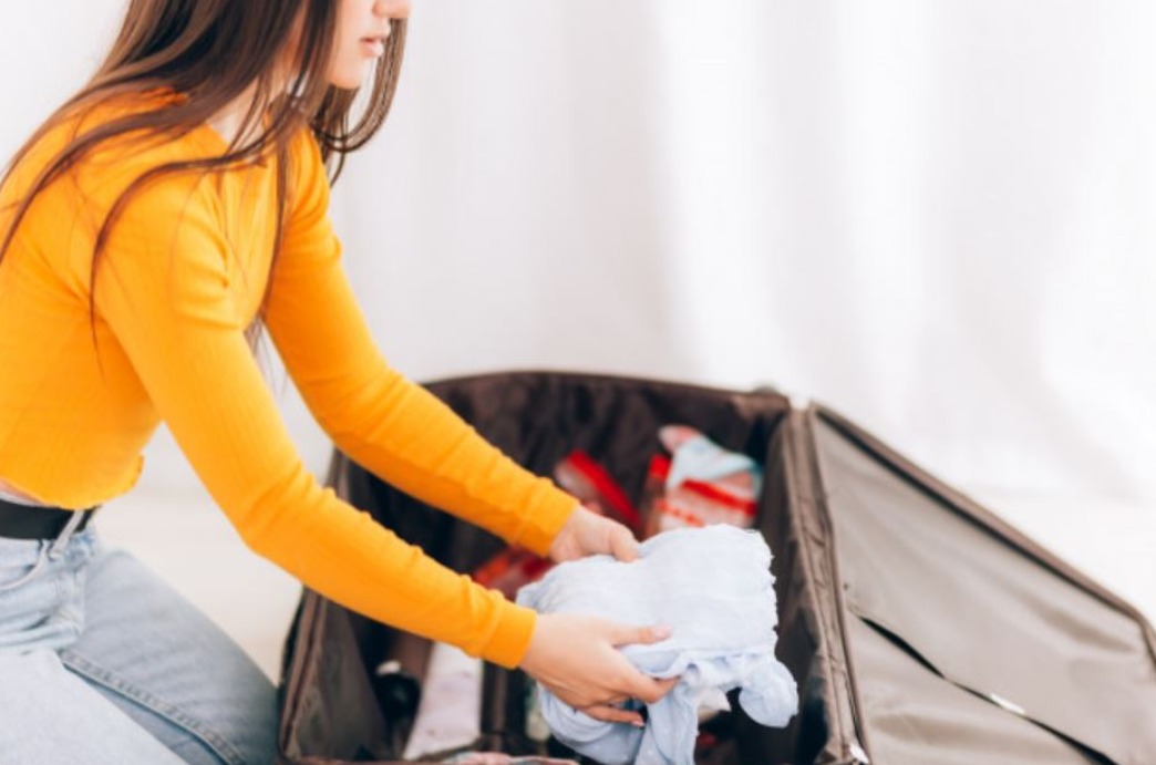 woman organising her luggage.jpeg