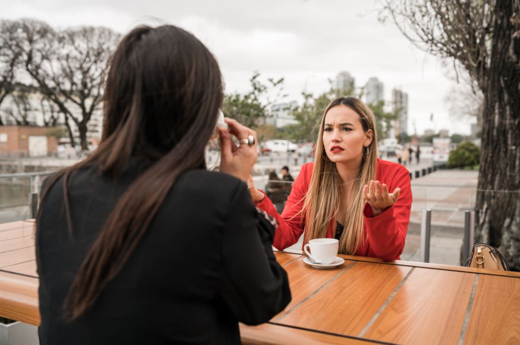 two women sitting on a terrace.JPG