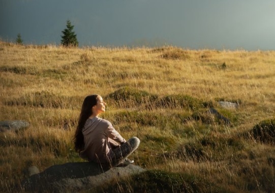 Woman meditating in nature.jpg