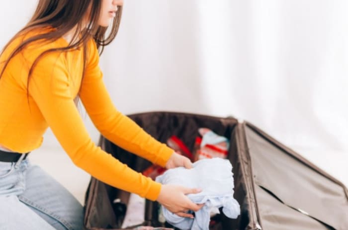 woman organising her luggage.jpeg