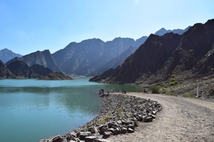 Reservoir water surrounded by rocky mountains at Hatta Dam..jpg