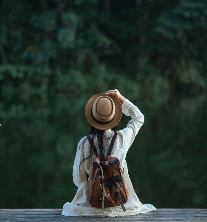 woman-sitting-in-front-of-tropical-forest.jpg