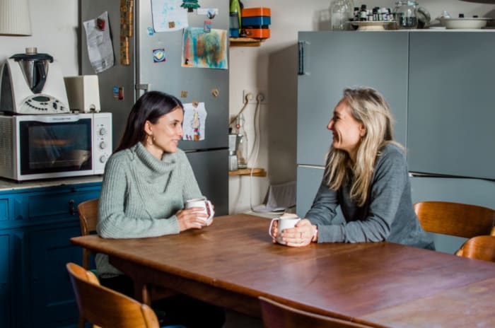 women in a kitchen talking over coffee .jpeg