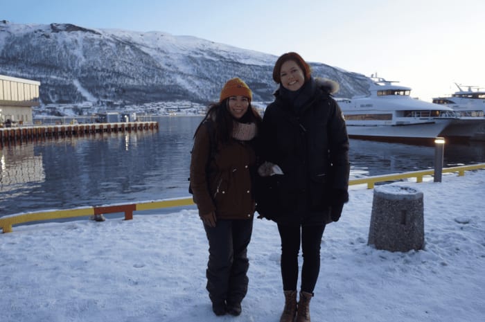 a traveler meeting a hostess in Tromso.png