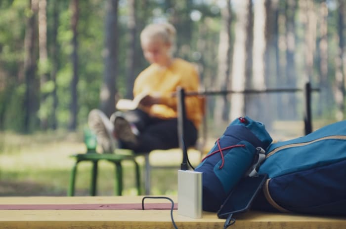 woman sit on a suitcase.jpeg