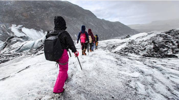 group-of-women-walking-in-the-mountains-with-snow.jpeg