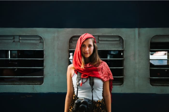 woman with a red scarf and a camera .jpeg