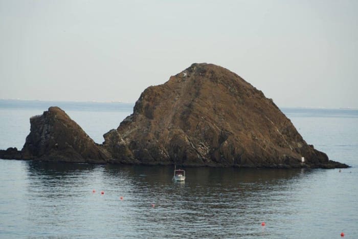 Snoopy Island rising from the sea off Al Aqah in Fujairah..jpg
