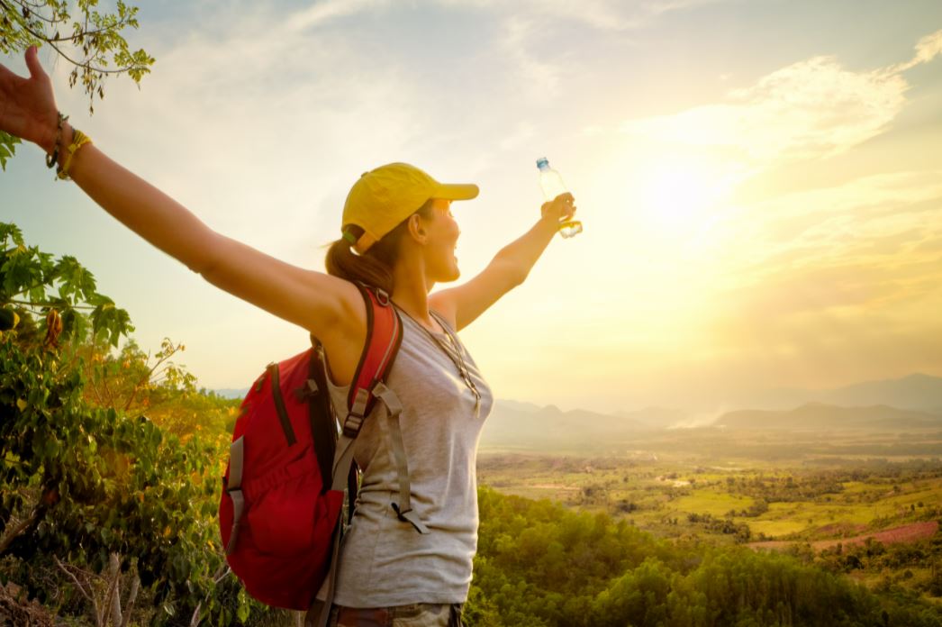 woman looking towards the horizon with open arms .JPG