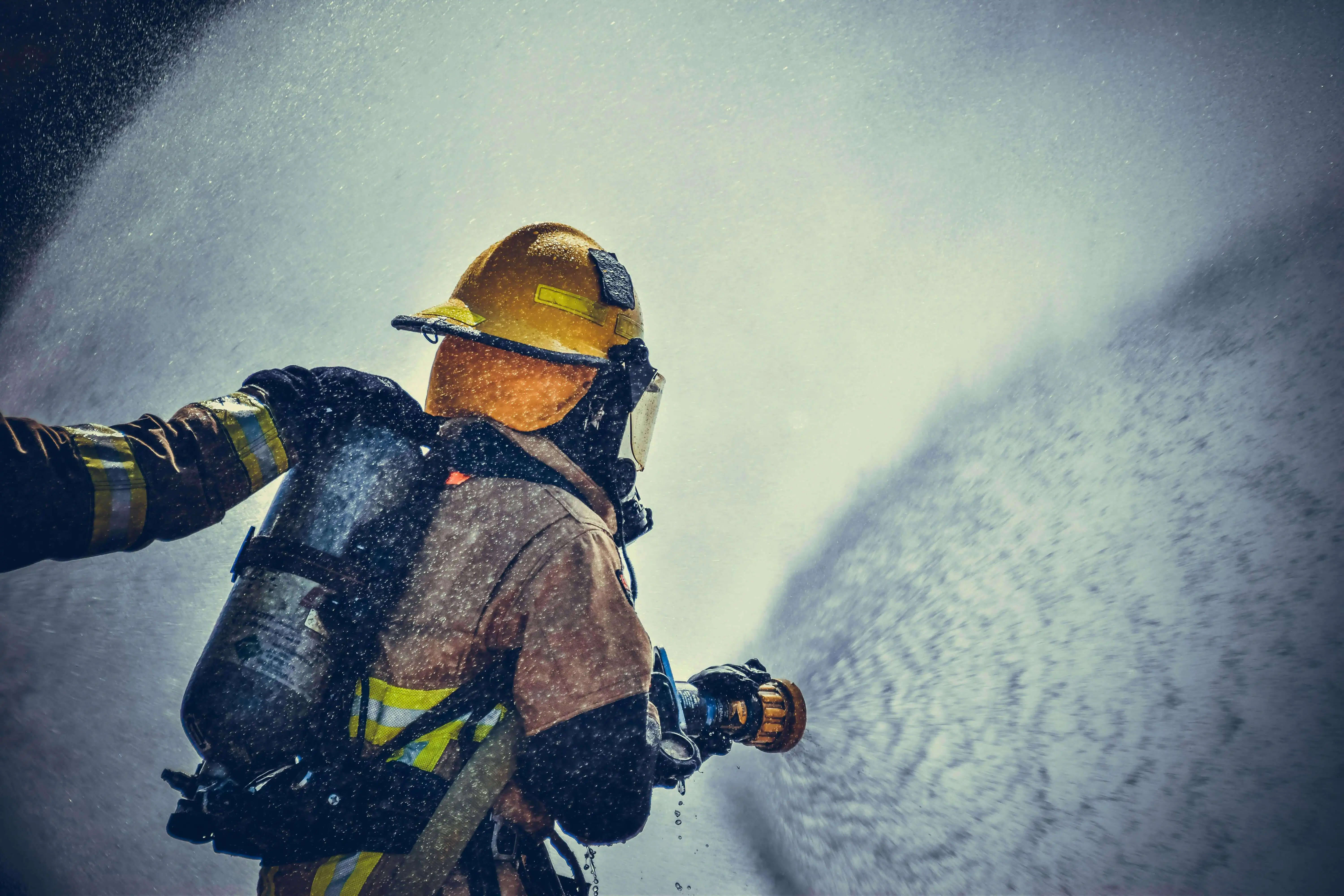 Trained fire safety professional demonstrating firefighting service