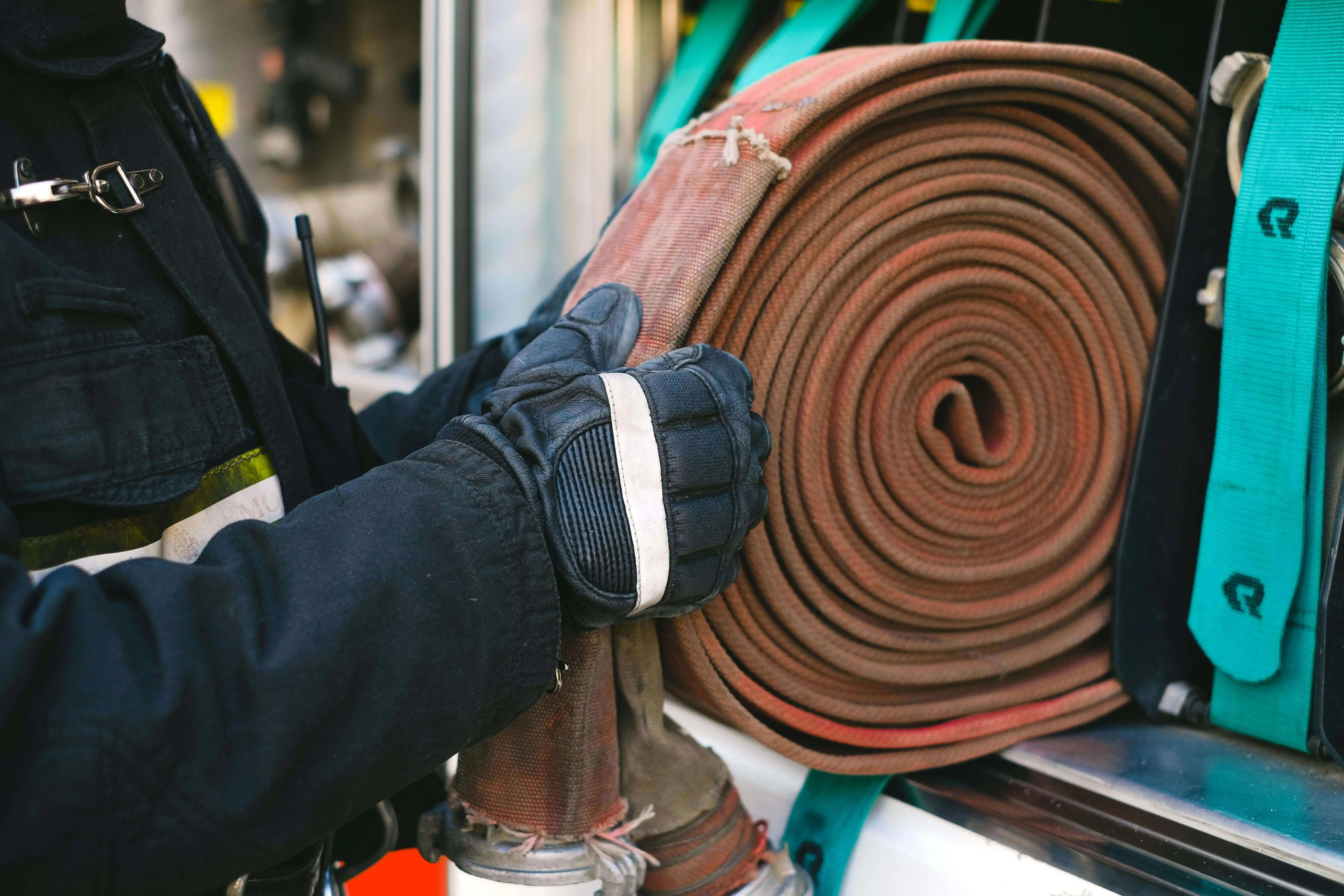 Rolled fire hose neatly placed on rack