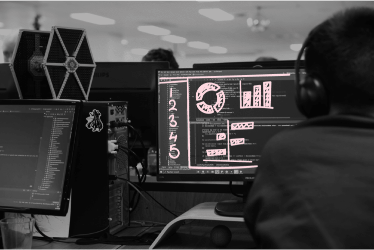 A photo of a man working at a computer