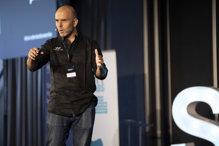 Eban Escott, the ceo of workingmouse, talking on stage