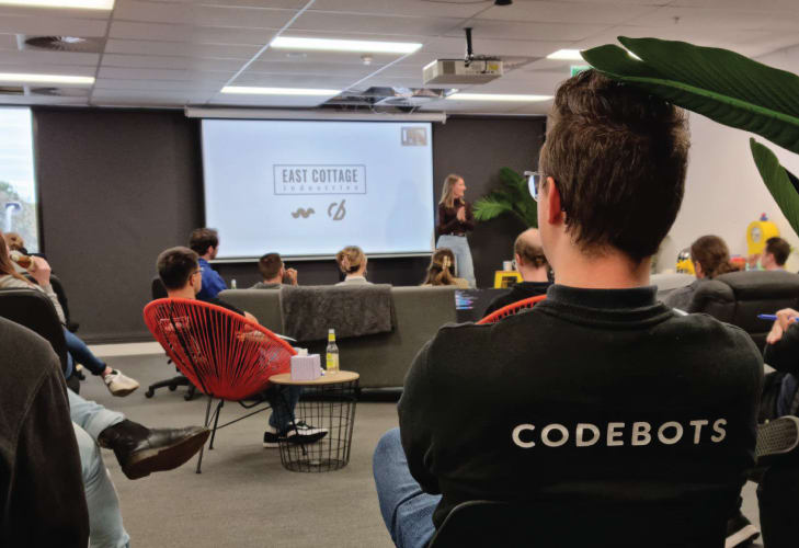 The workingmouse employees at hq watching a presentation