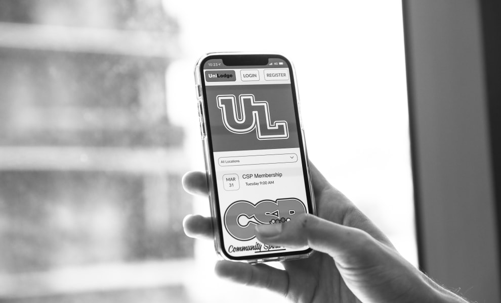 A photo of a hand holding a phone. on the screen is the application 