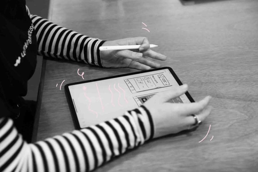 A close of of someones hands using an ipad