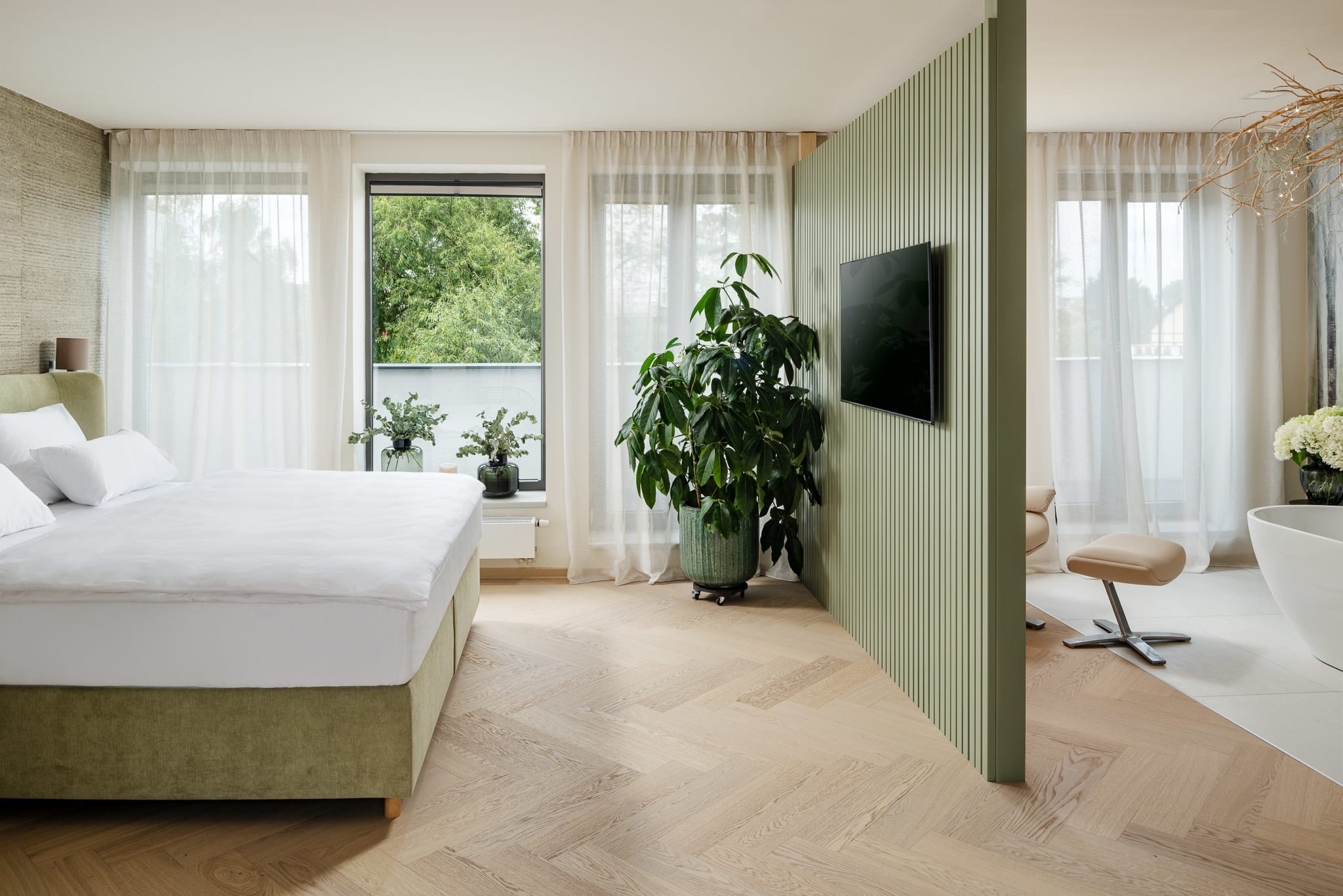 Hotel room with sage accents