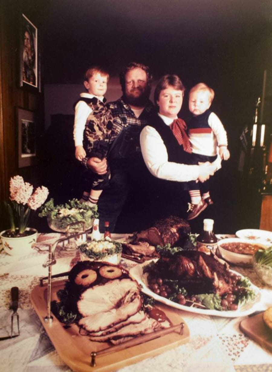 Holiday table: Jim holding Lee, Donna holding baby Michael