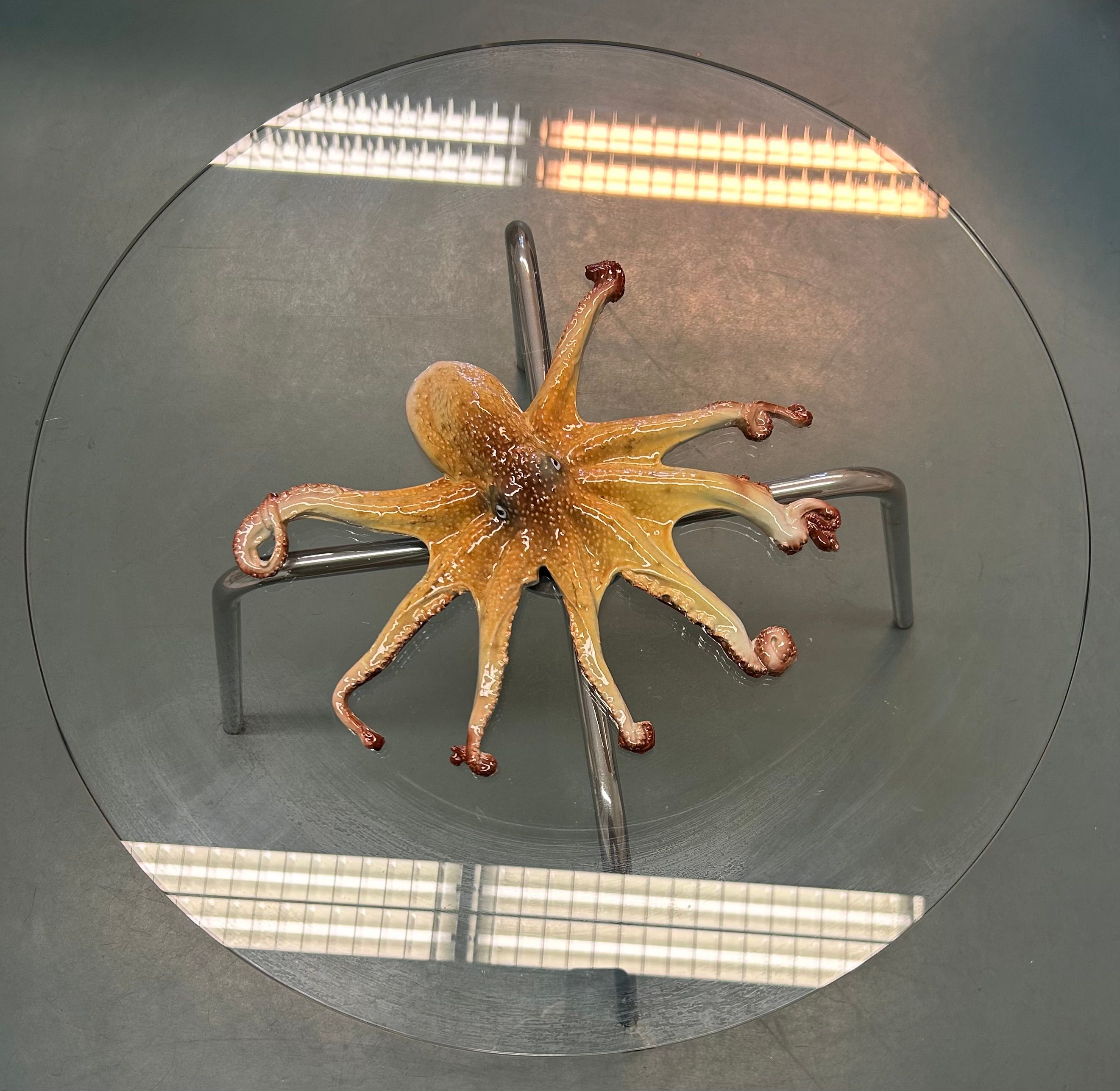 Octopus figure on round glas table