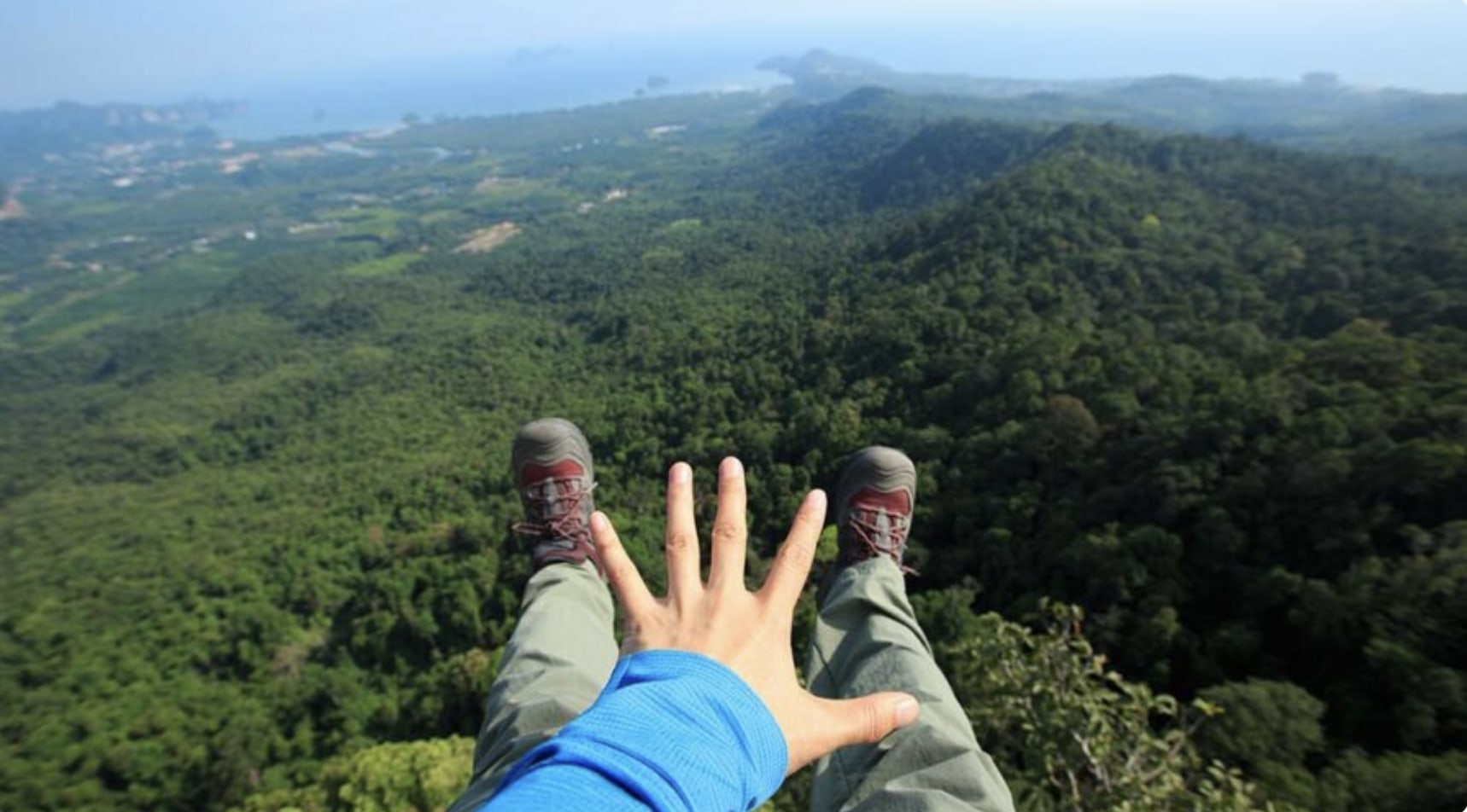 Paragliding landing with pilot control and smooth touchdown.