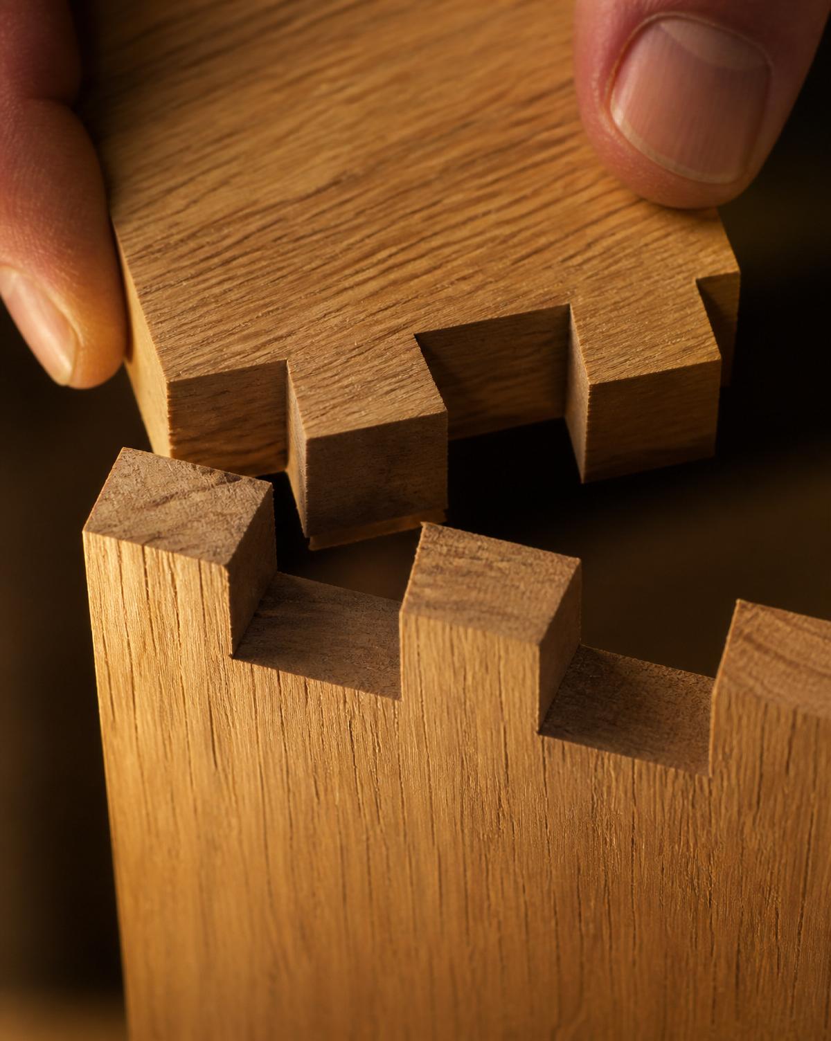 Hand-fitted dovetail joint in warm oak
