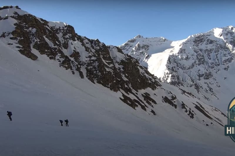 Snow wall at Buran Ghati pass with rappellers