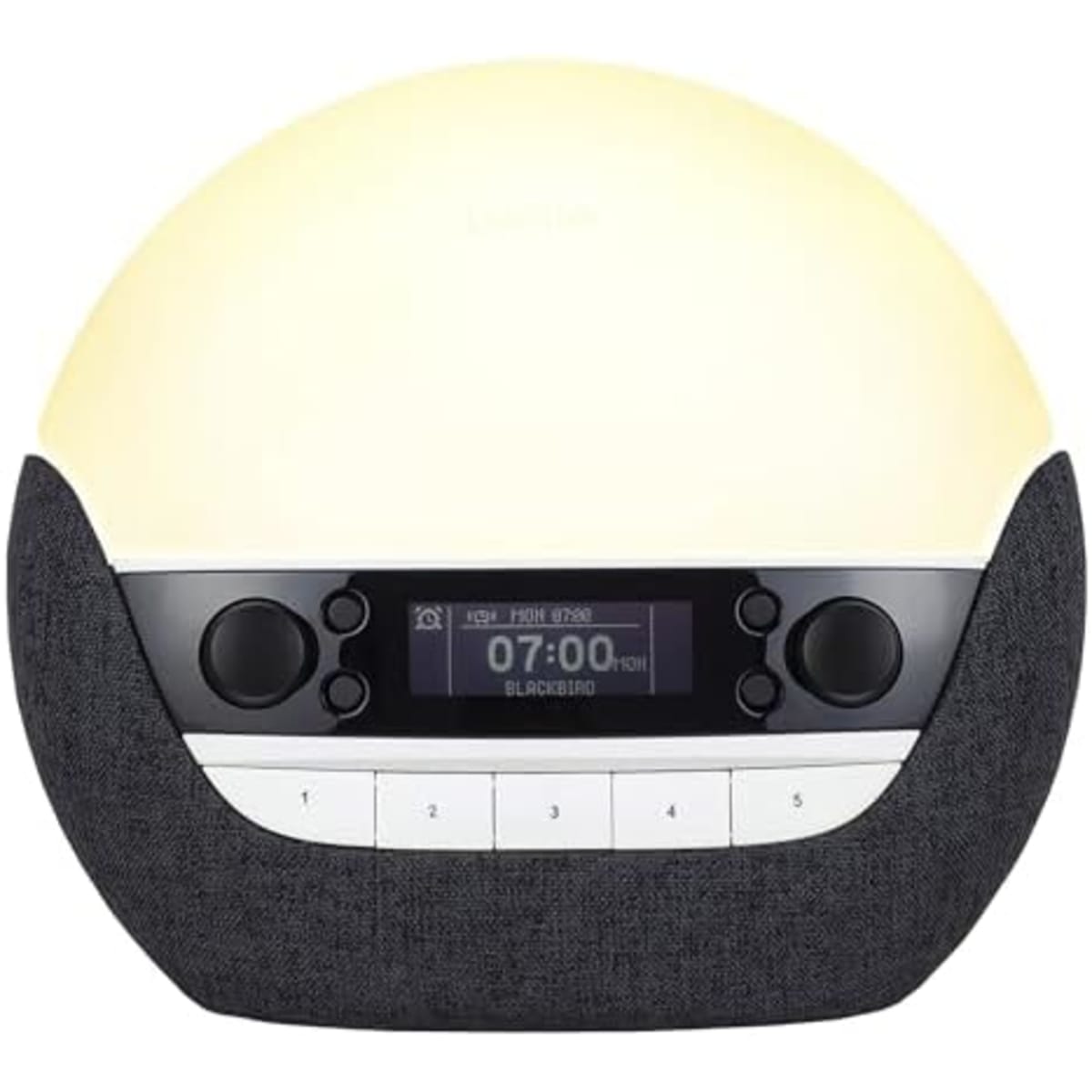 Lumie Bodyclock Luxe 750DAB posé sur une table de chevet dans une chambre tamisée