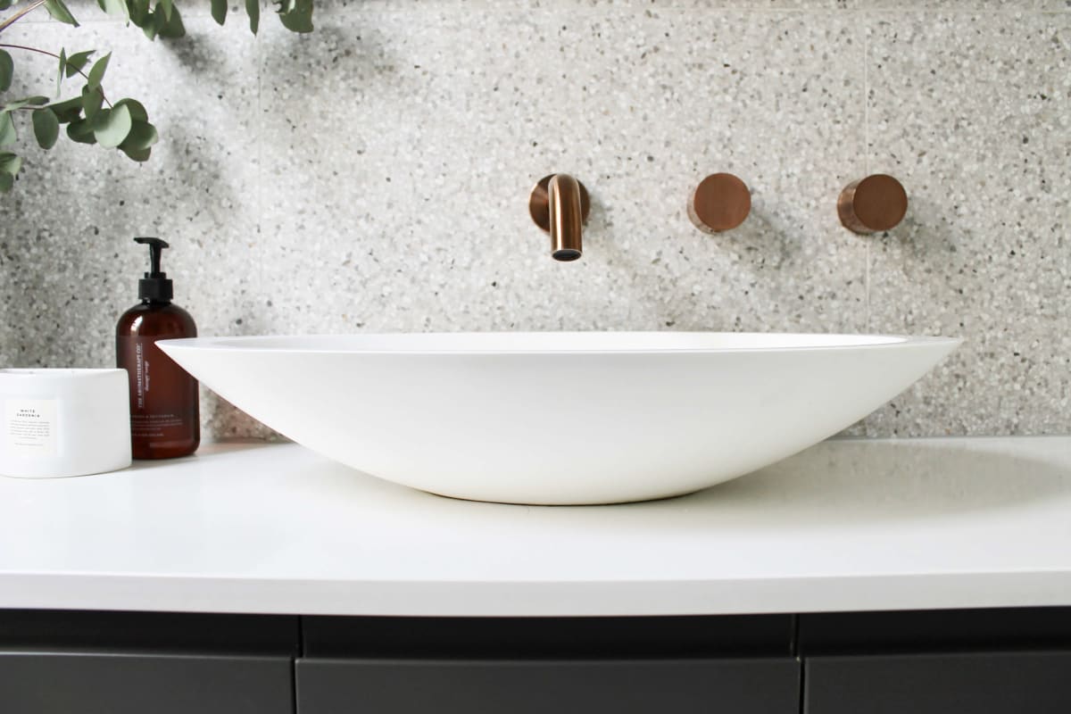 sleek Thornbury, Melbourne bathroom renovation, bronze bathroom fittings and bathroom basin