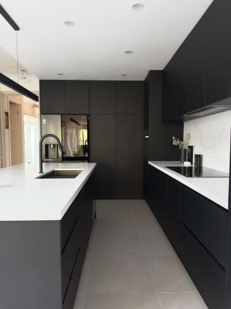 Thornbury Melbourne Kitchen renovation. Black cabinetry with white bench tops