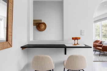CLifton Hill Melbourne kitchen renovation. Black kitchen counter with fluffy white stools