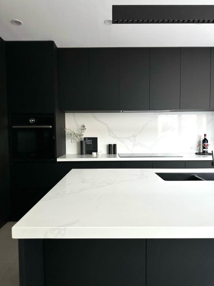 Thornbury Melbourne Kitchen renovation. Black cabinetry with white bench tops