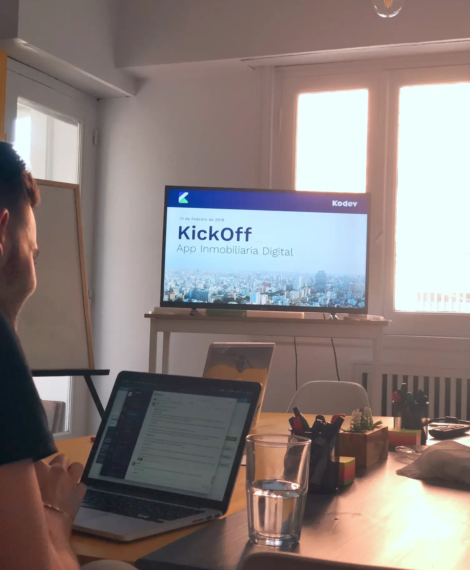 Photograph of a screen displaying the kickoff of the digital real estate project