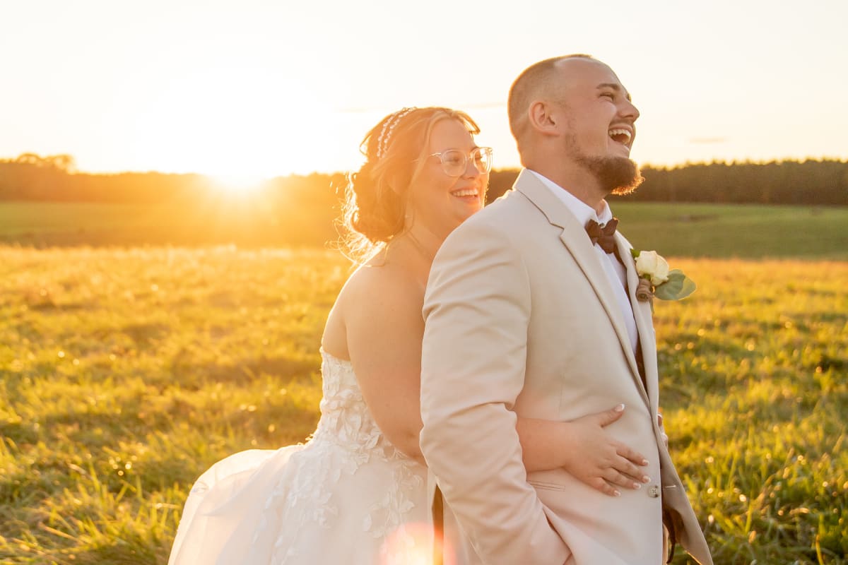 Couple sharing laughs during golden hour at Oak Creek Farm microwedding in Virginia