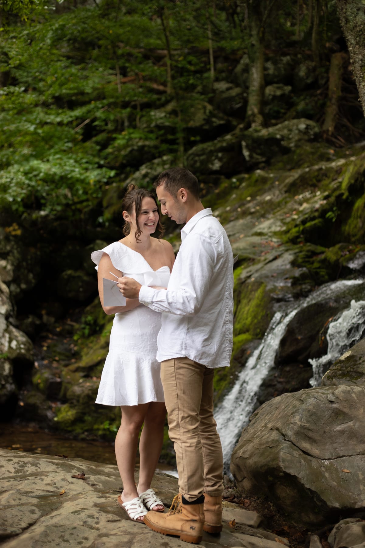 Couple sharing vows by Dark Hollow Falls in Shenandoah