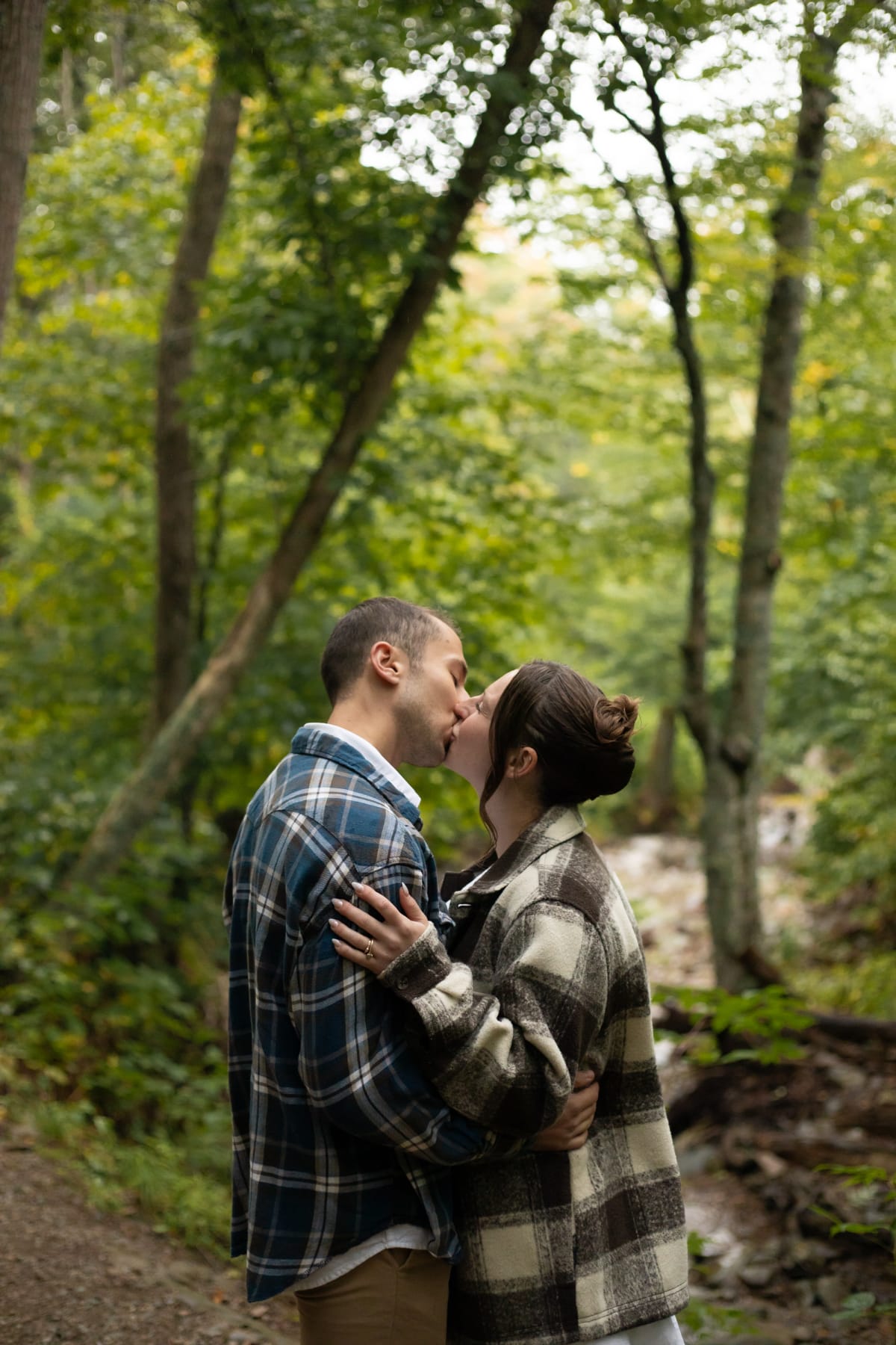 Couple sharing a romantic moment during their summer Shenandoah National Park elopement hike