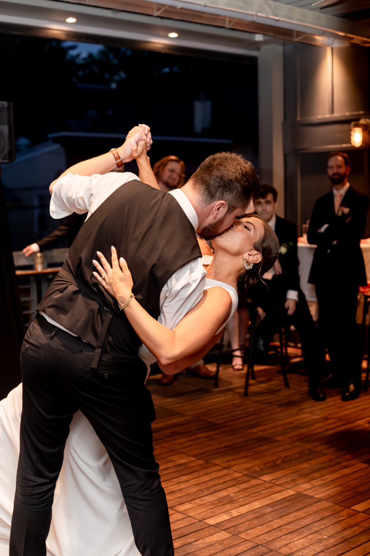 Couple's first kiss at the end of their tavern microwedding