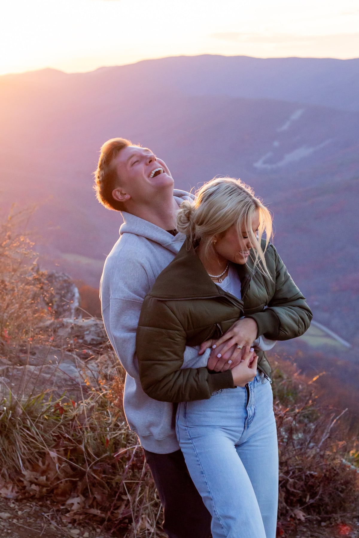 Lighthearted engagement session moments at Raven's Roost Overlook in Virginia