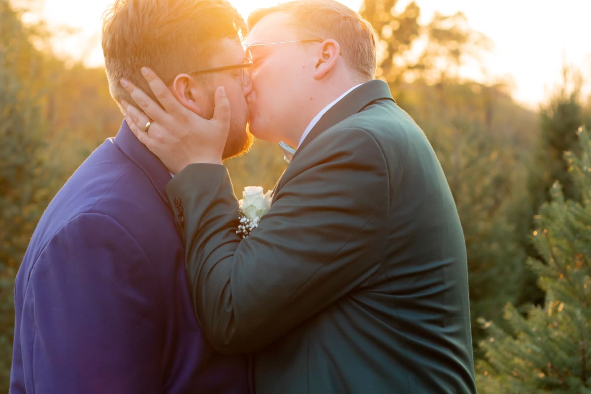 Golden sunlit portraits during a Virginia Christmas Tree Farm microwedding