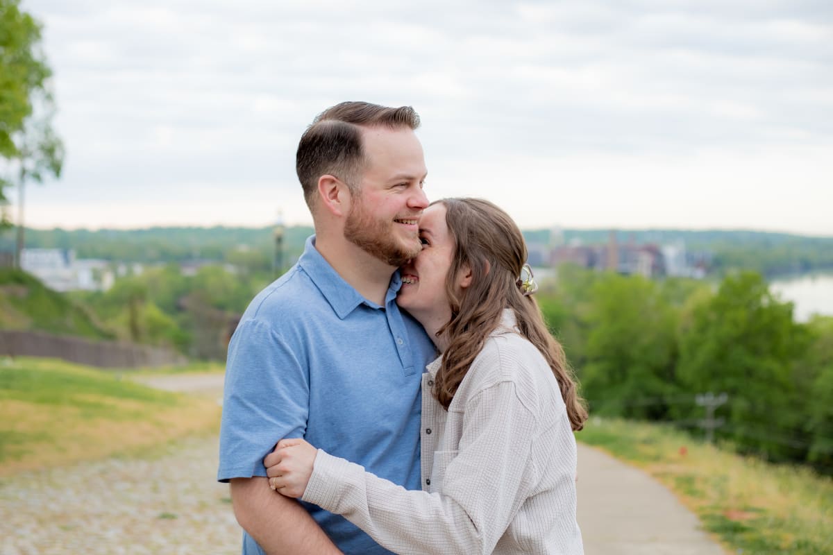 Engaged couple sharing laughs in Richmond, Virginia