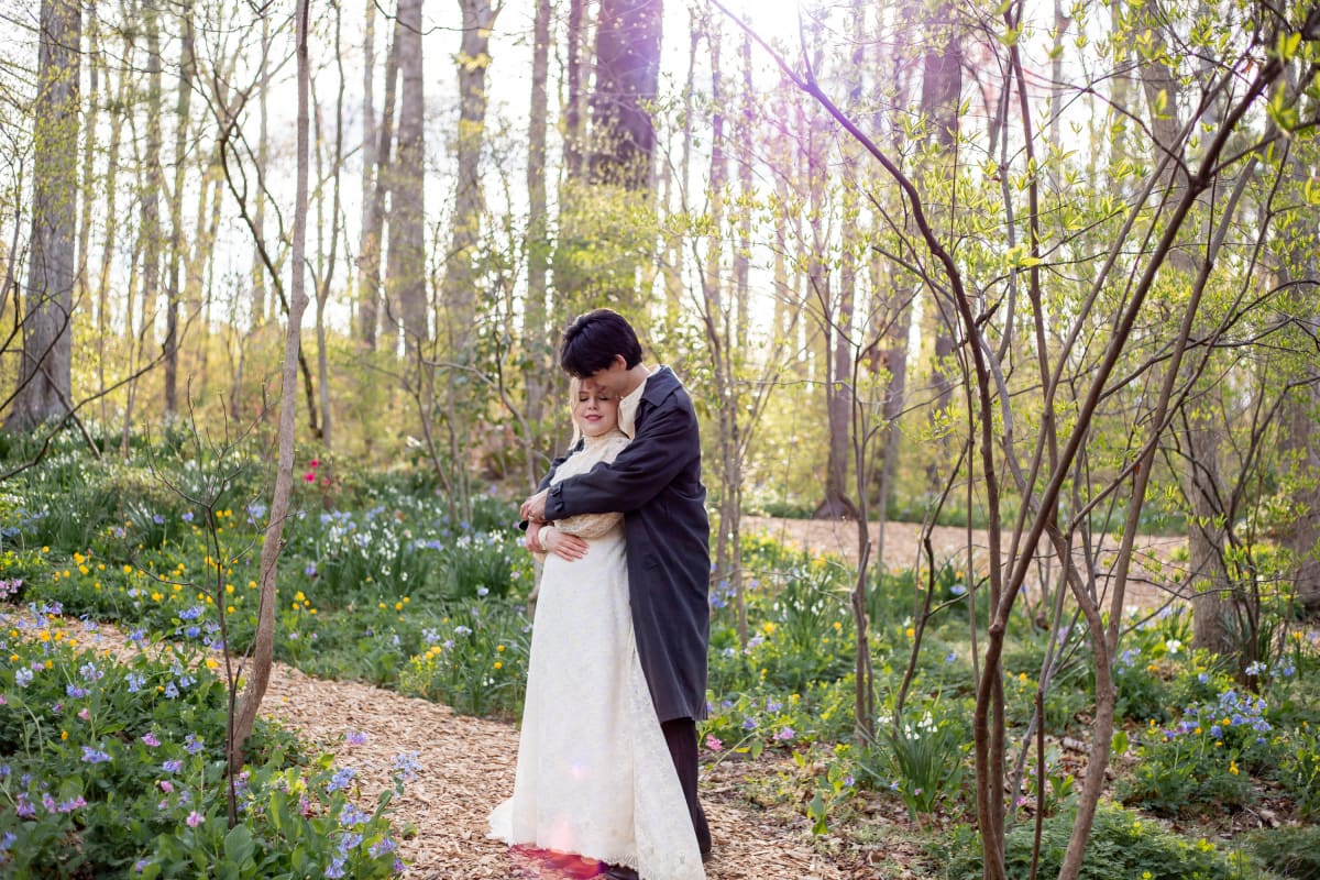 Sunlit couple's portrait at Edith J. Carrie Arboretum in Virginia