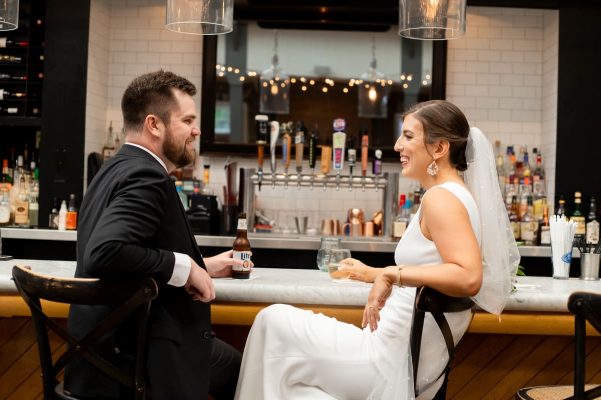 Couple enjoying cocktail hour at their tavern microwedding
