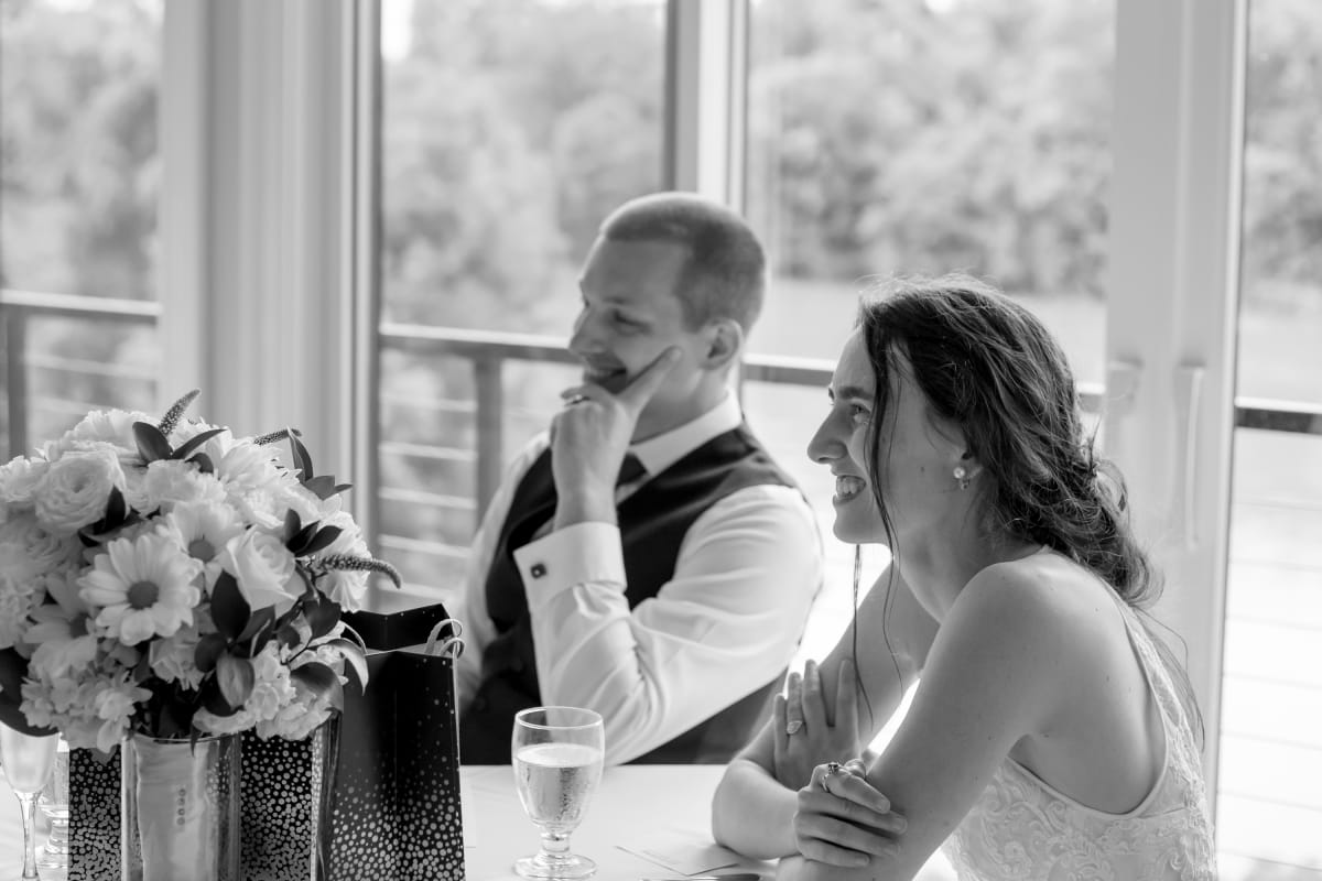 Couple sharing laughs during their microwedding in Downtown Fredericksburg, Virginia