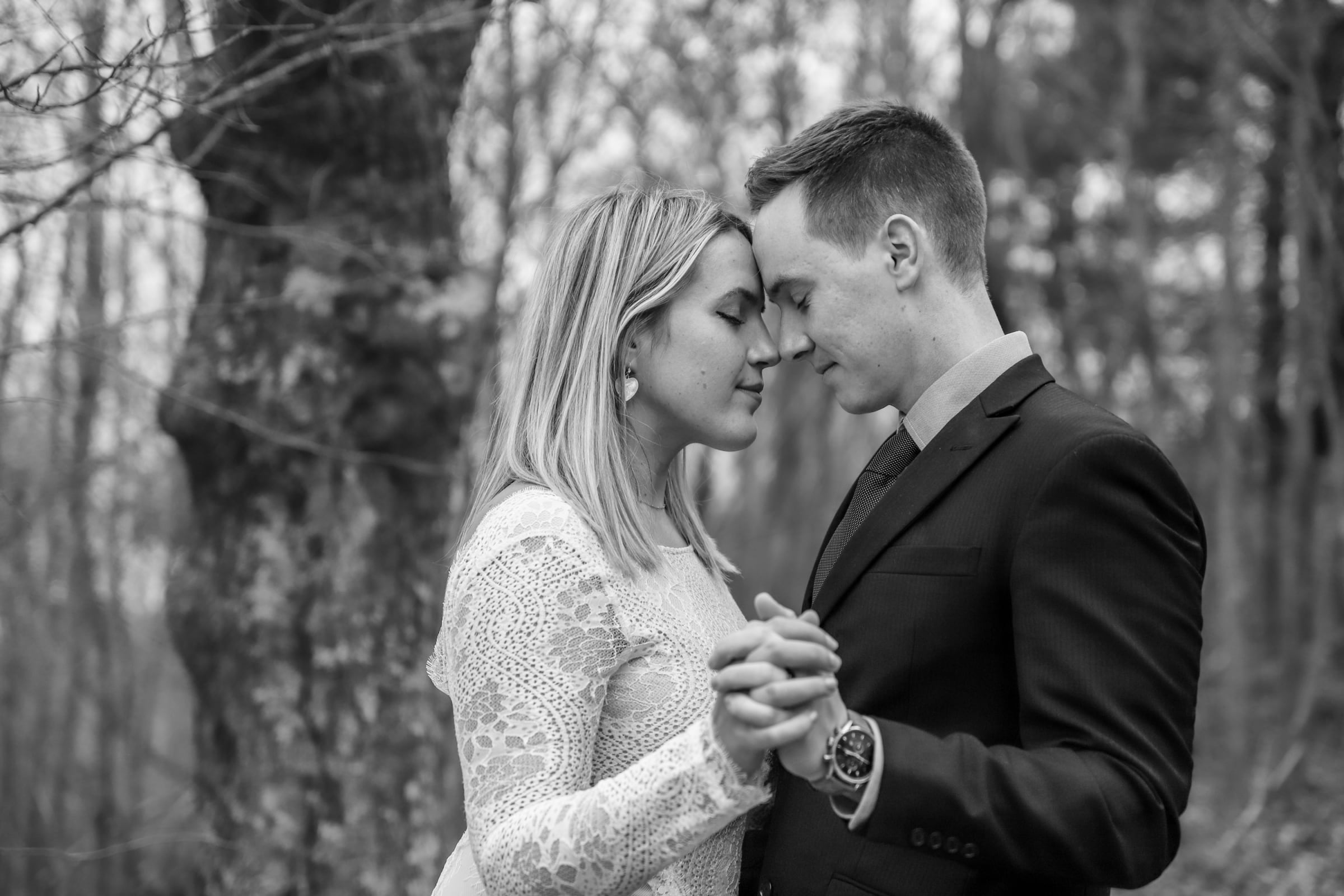 couple sharing a quiet moment together in the forests of Shenandoah National Park during their elopement