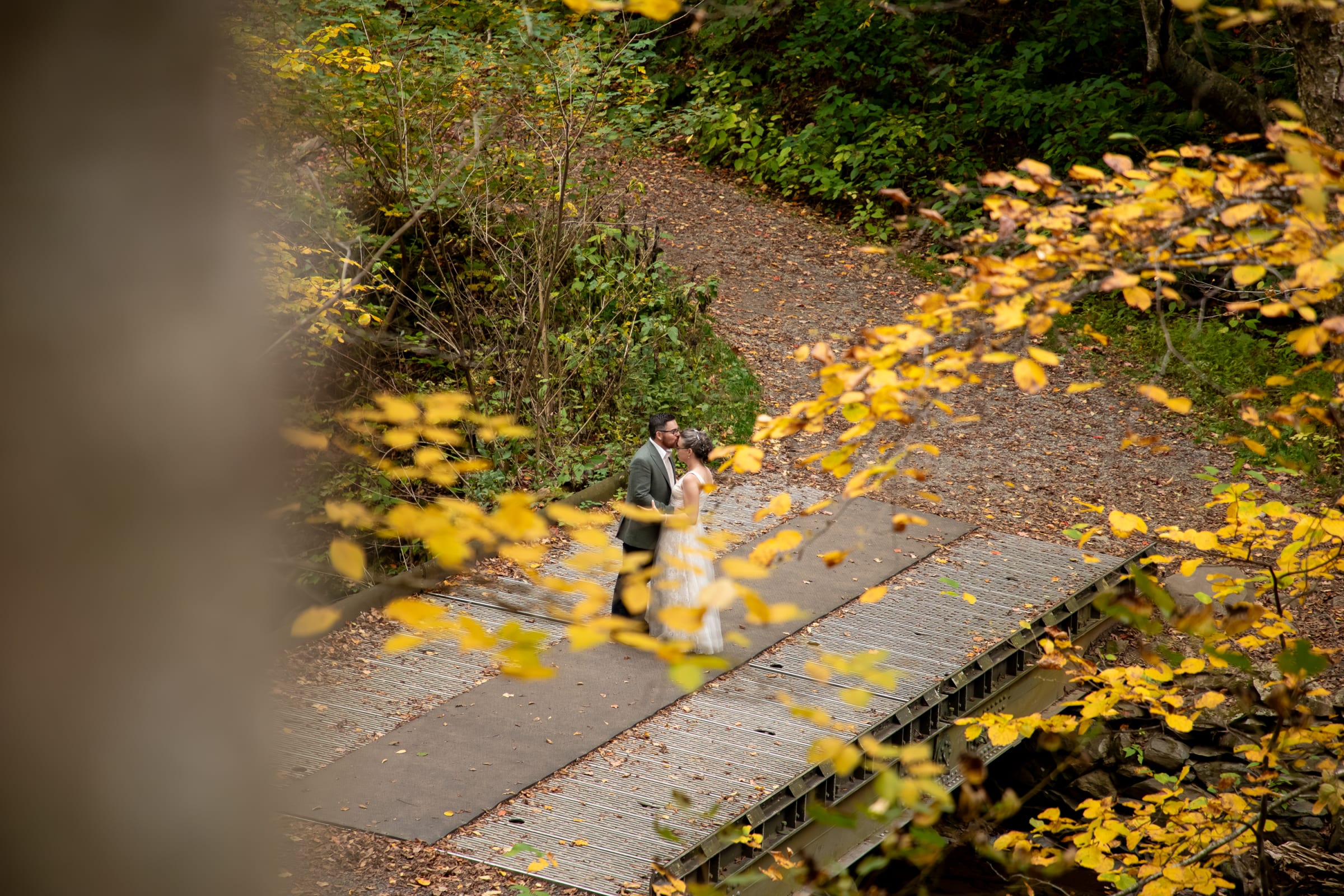 couple dancing during their fall elopement surrounded by peak foliage in Shenandoah National Park