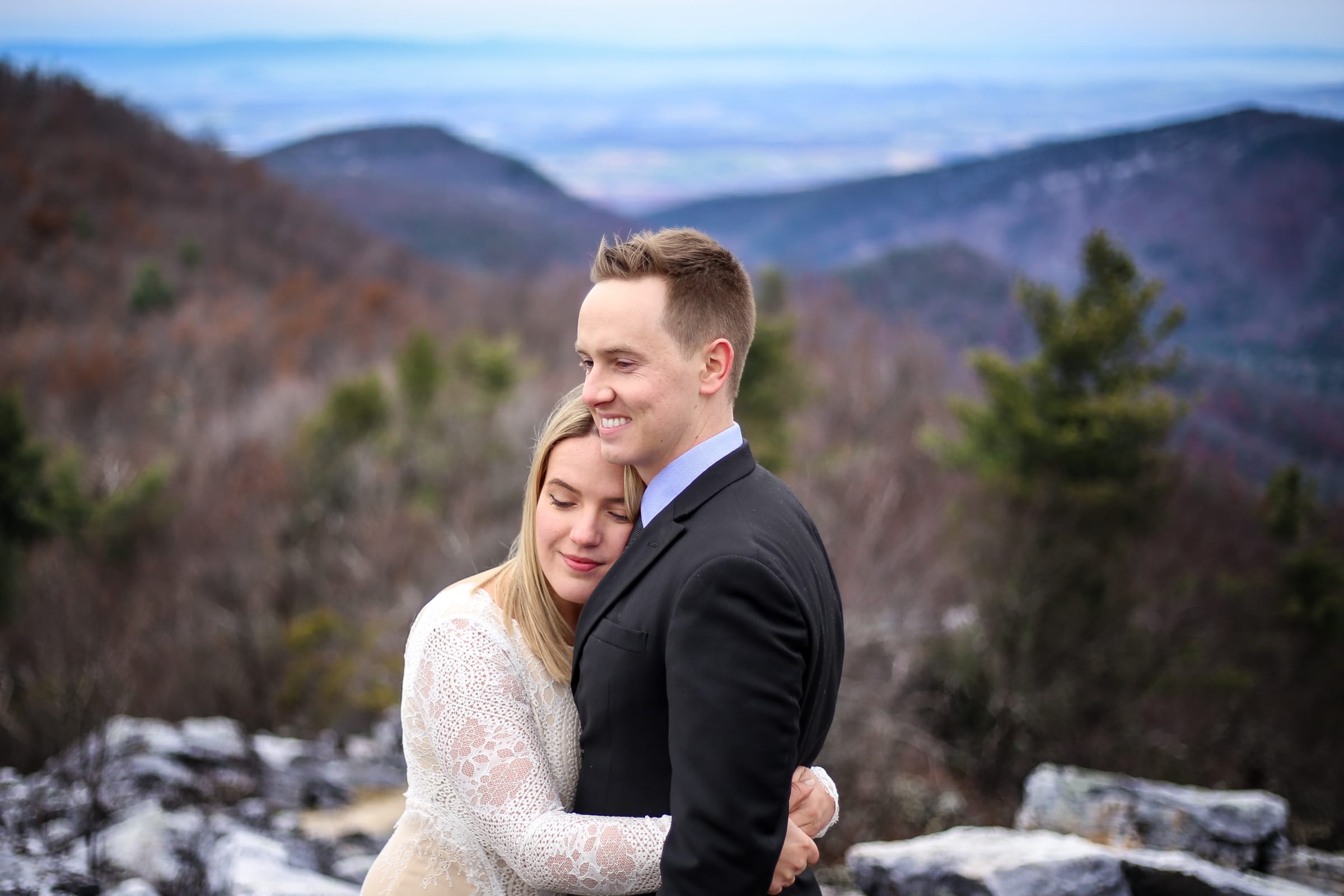 Couple embracing at Blackrock Summit in winter, Shenandoah National Park