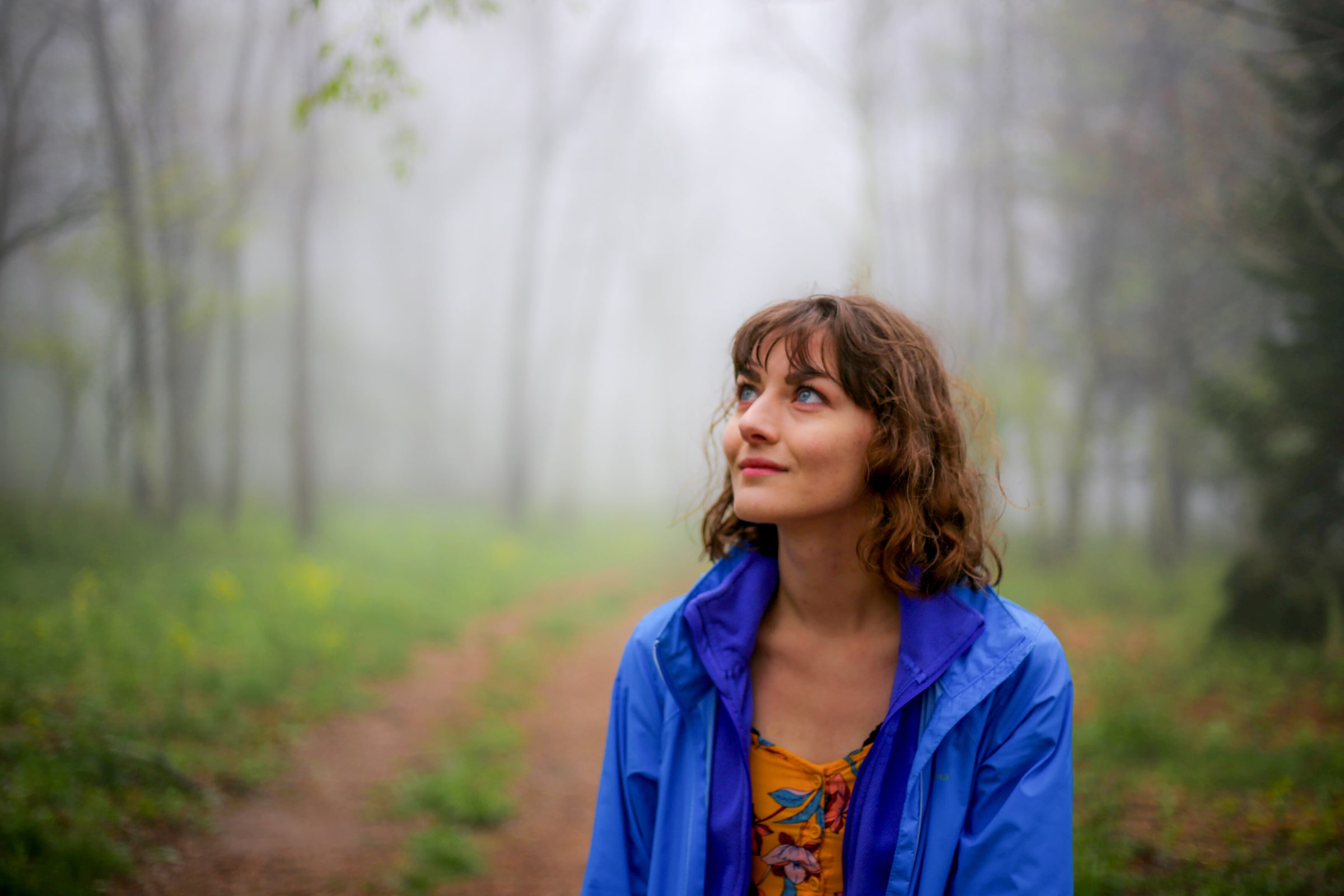 Alysa Segovia, Virginia elopement photographer, in a misty forest