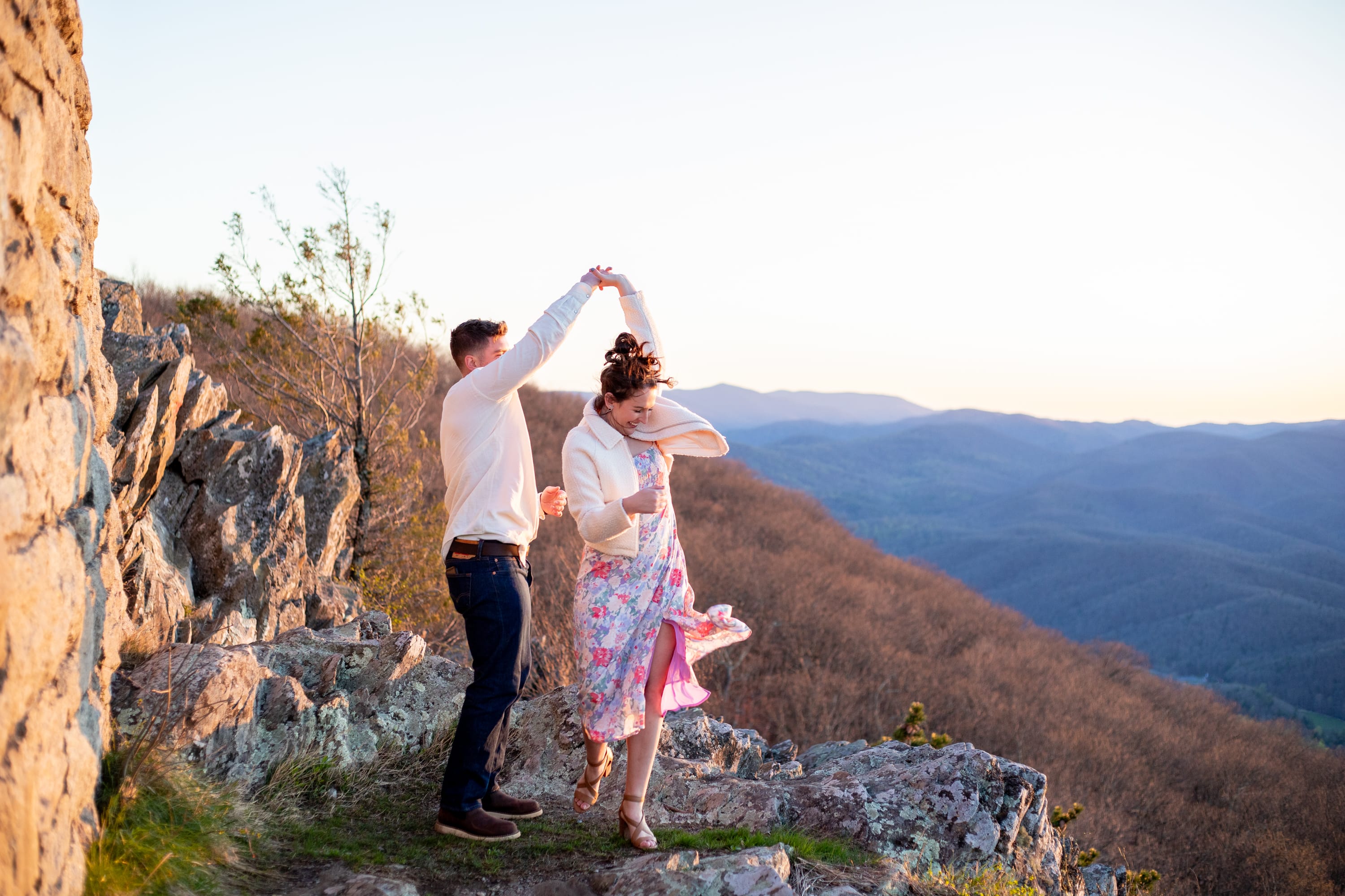 Couple dancing on the mountainside of Raven's Roost Overlook on the Blue Ridge Parkway, Virginia