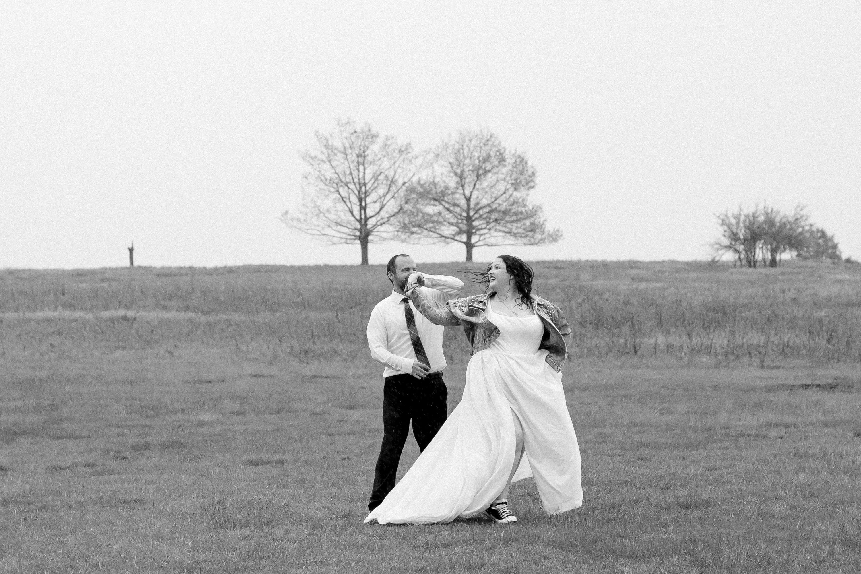 Couple dancing in the open meadow at Big Meadows in Shenandoah National Park, black and white